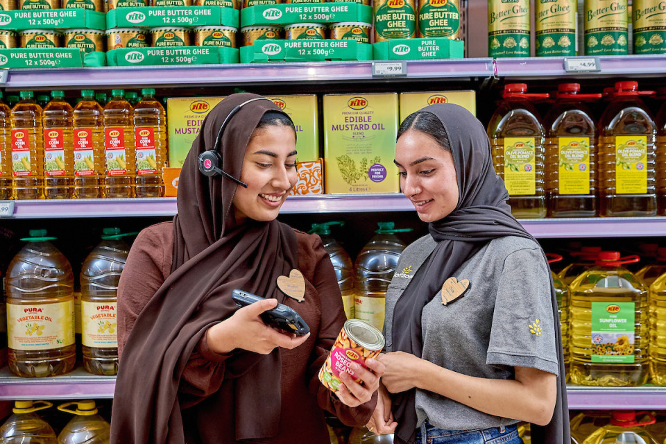Colleagues scanning products in store