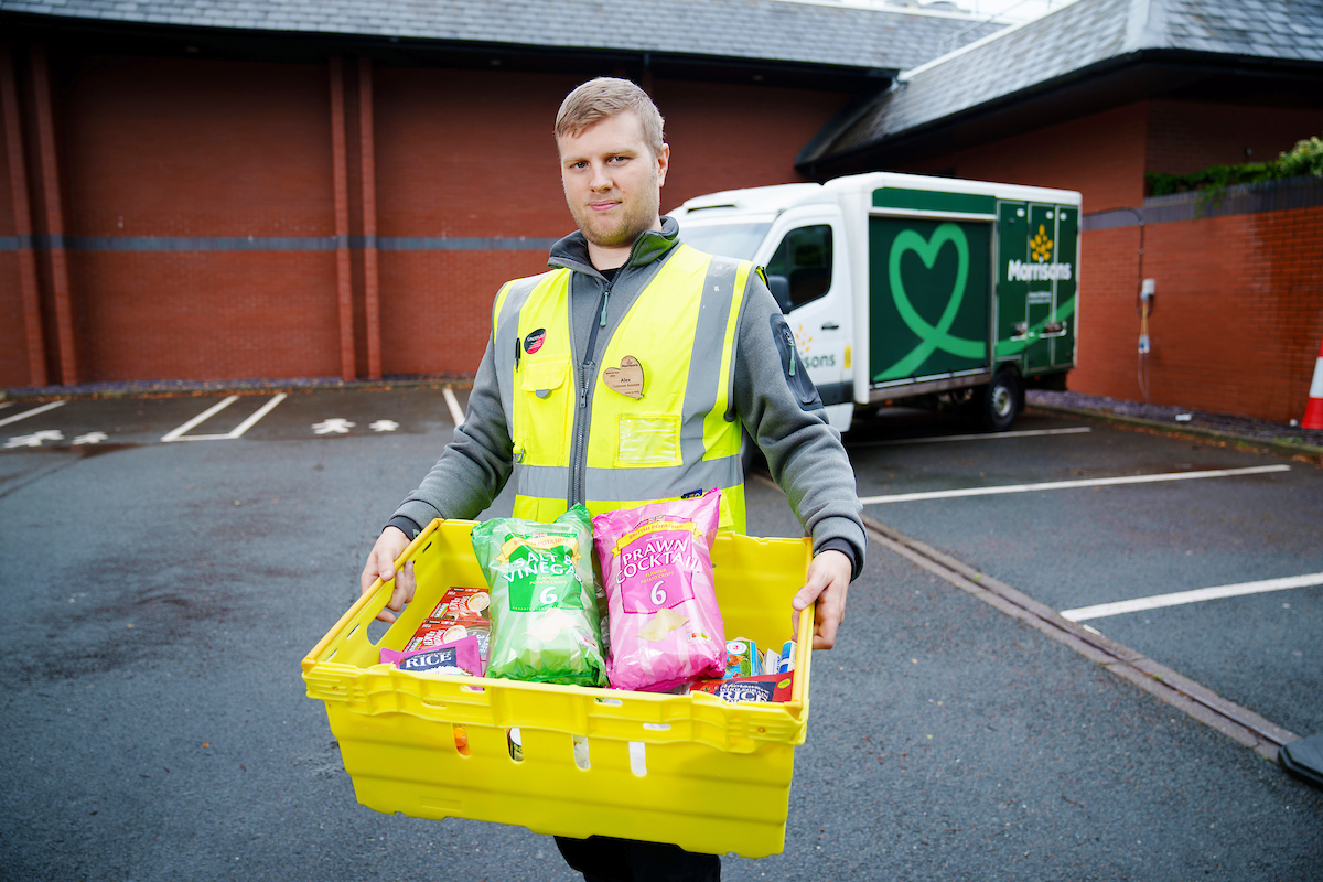 Delivery colleague carrying box of products